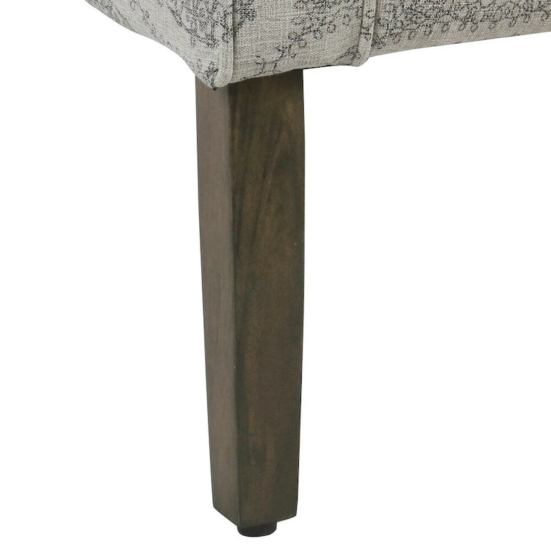 Fauteuil d'appoint gris en forme de baignoire avec médaillon